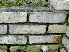 
'Wall remains' of the 'Engine House' at Mine Slope Colliery, Upper Cwmbran. Several bricks are stamped 'PARFITT CWMBRAN', others stamped with an 'H'