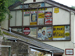 
The tinplate signs on the side of the shop, Cheltenham, Clydach Gorge, July 2012
