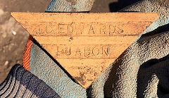 
A green glazed triangular tile from J C Edwards, Ruabon, Denbighshire  © Photo courtesy of Ian Evans