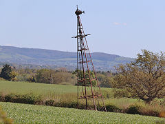 A derelict and tipsy wind pump at Purton, April 2025