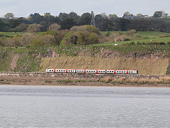 
A 'TfW' train heads for Lydney near Purton, April 2025