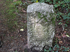 
'K', the Kendall side of the boundary stone beside the tramway, Carmears, June 2023
