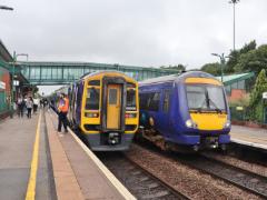 
'158 906' and '170 476' at Meadowhall, Sheffield, August 2023