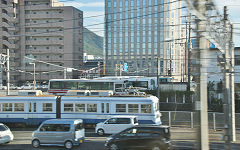 
Chikuho Electric Railroad unit '2002' at Kurosaki taken from a passing train, October 2017